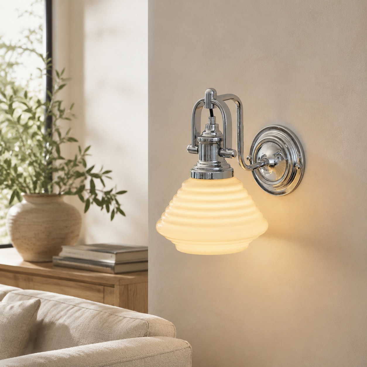 Creamy yellow glass wall sconce in sunlit lounge setting