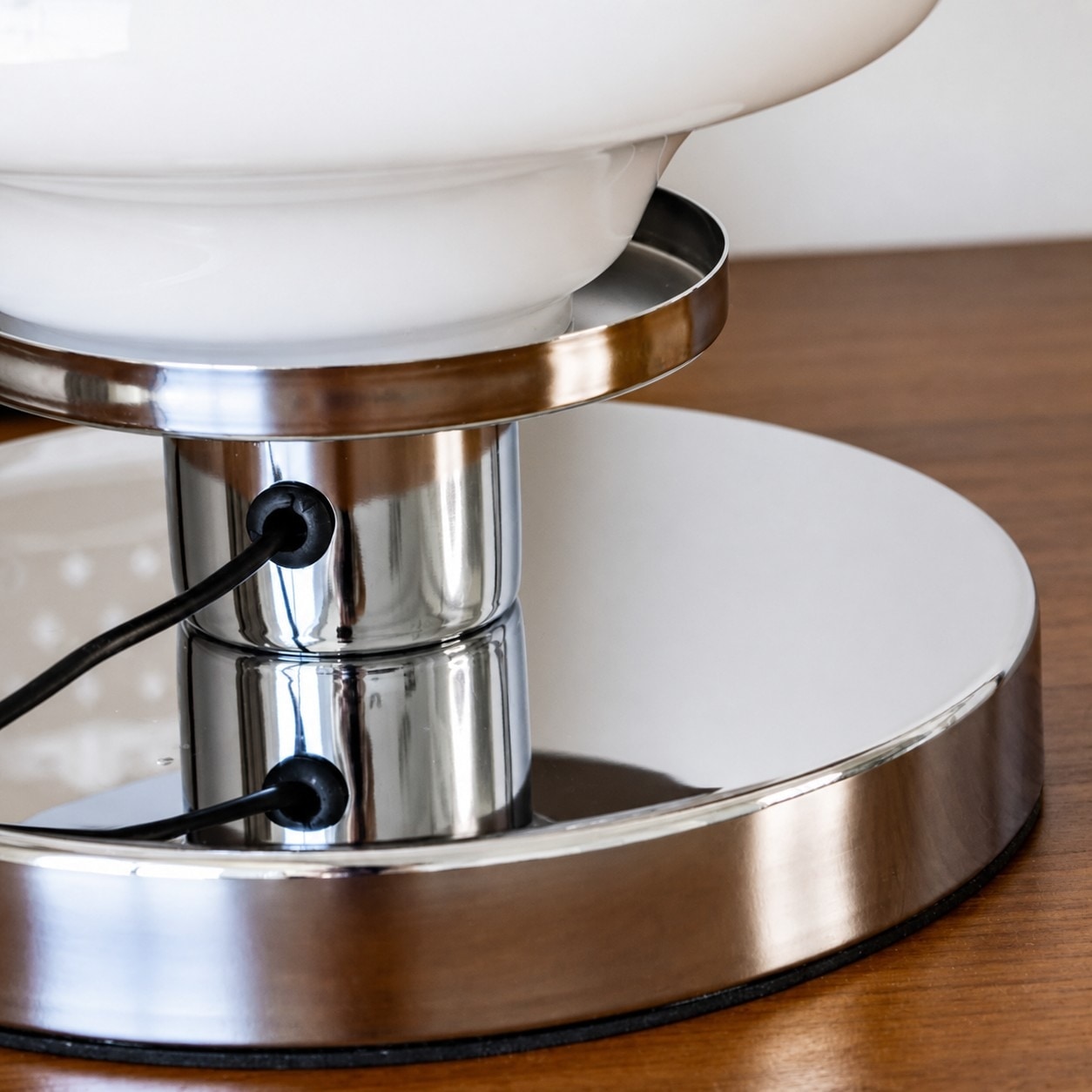 Chrome base and power cord detail on Bauhaus table lamp