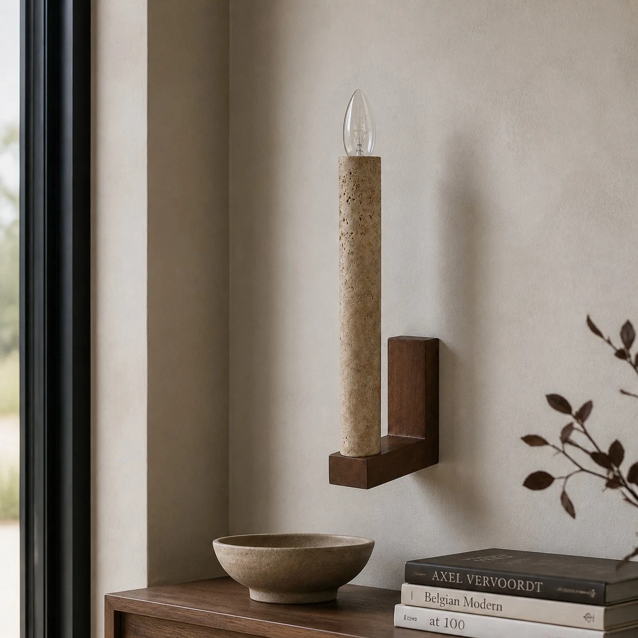 Natural travertine wall sconce above an entry console