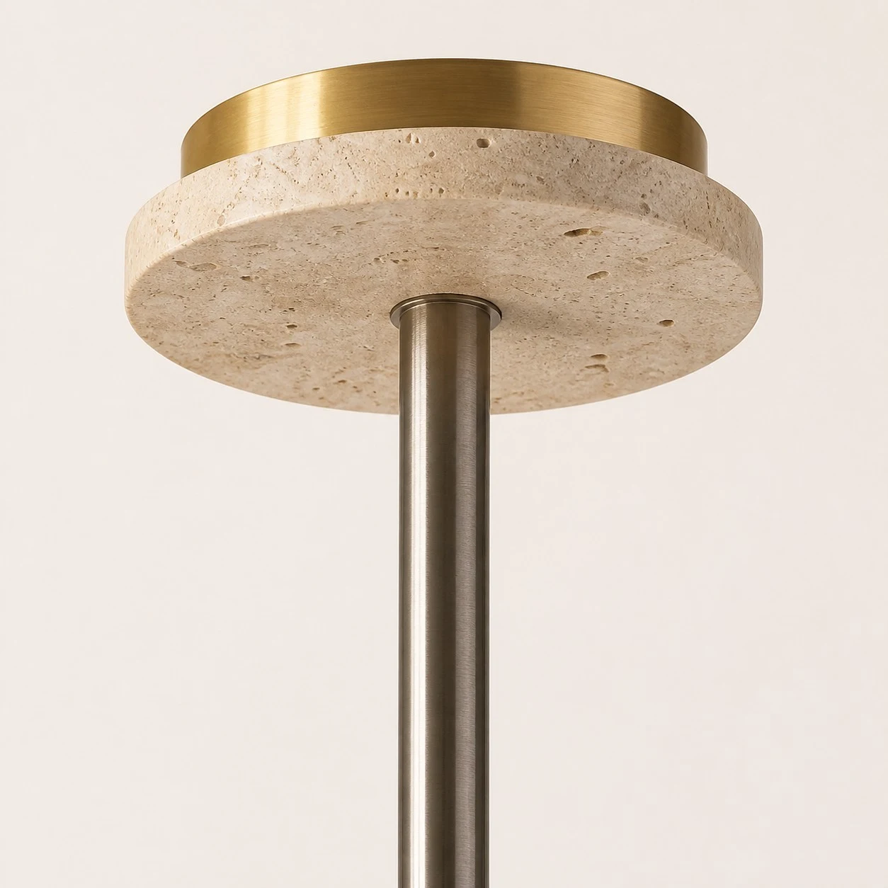Close view of the travertine ceiling canopy and metal suspension rod