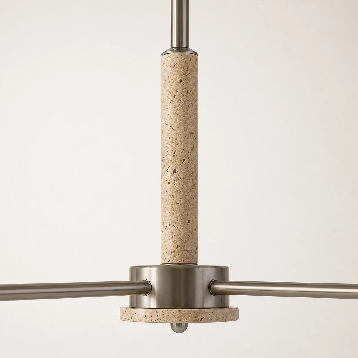 Close view of the travertine center column and metal arms