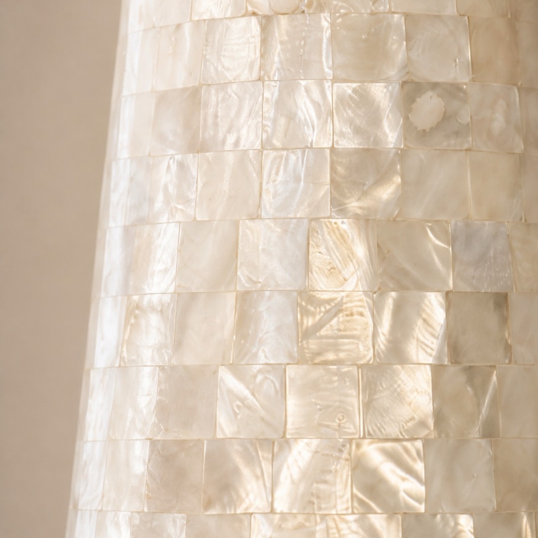 Close view of the pearlescent Capiz shell mosaic shade