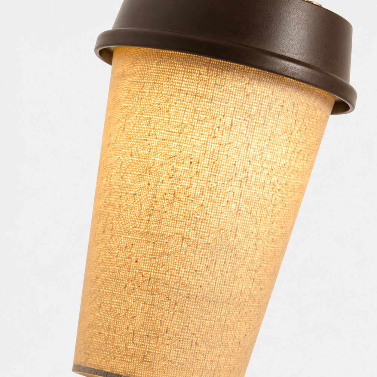 Rechargeable table lamp glowing fabric shade close-up
