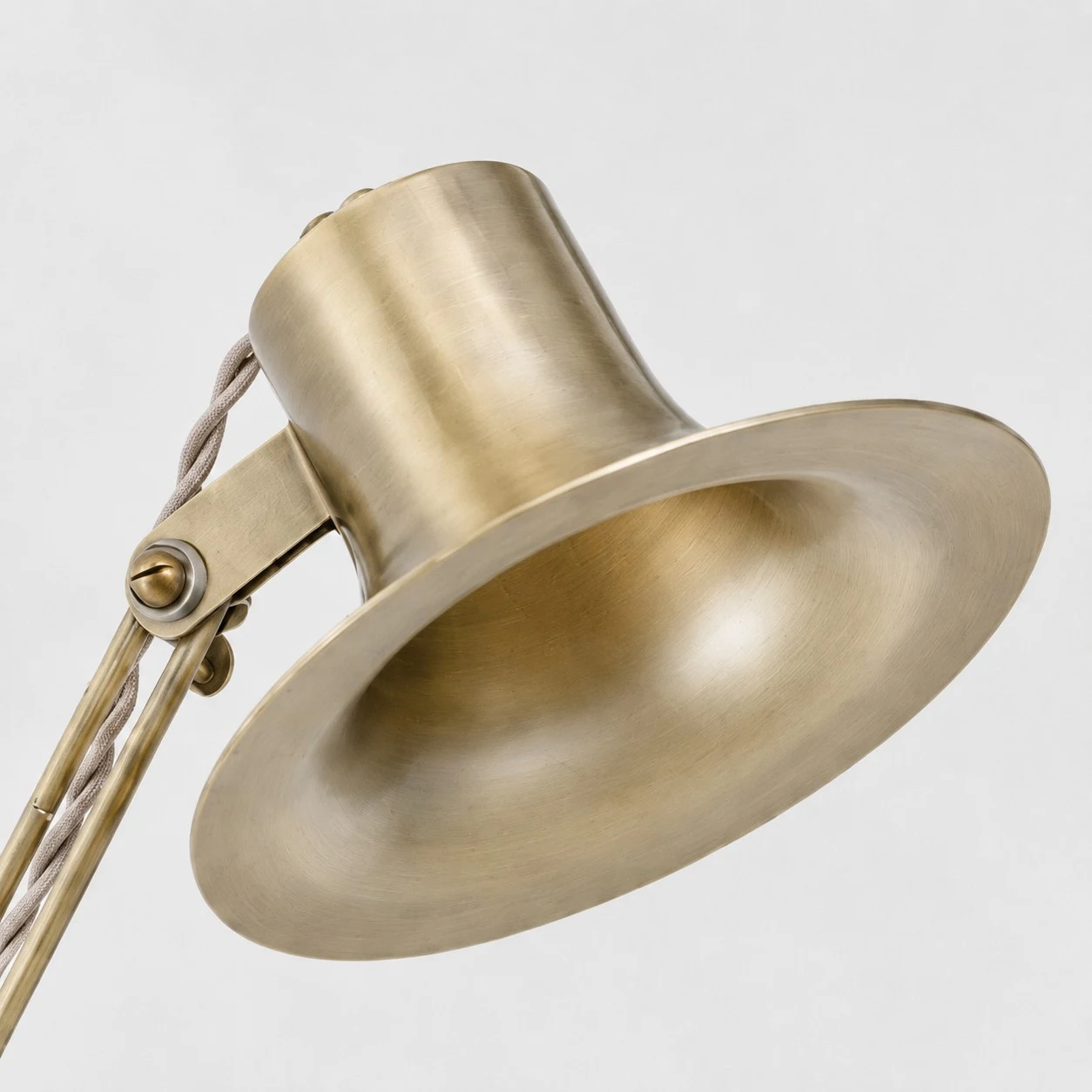 Close-up of the brass lamp shade and brushed surface