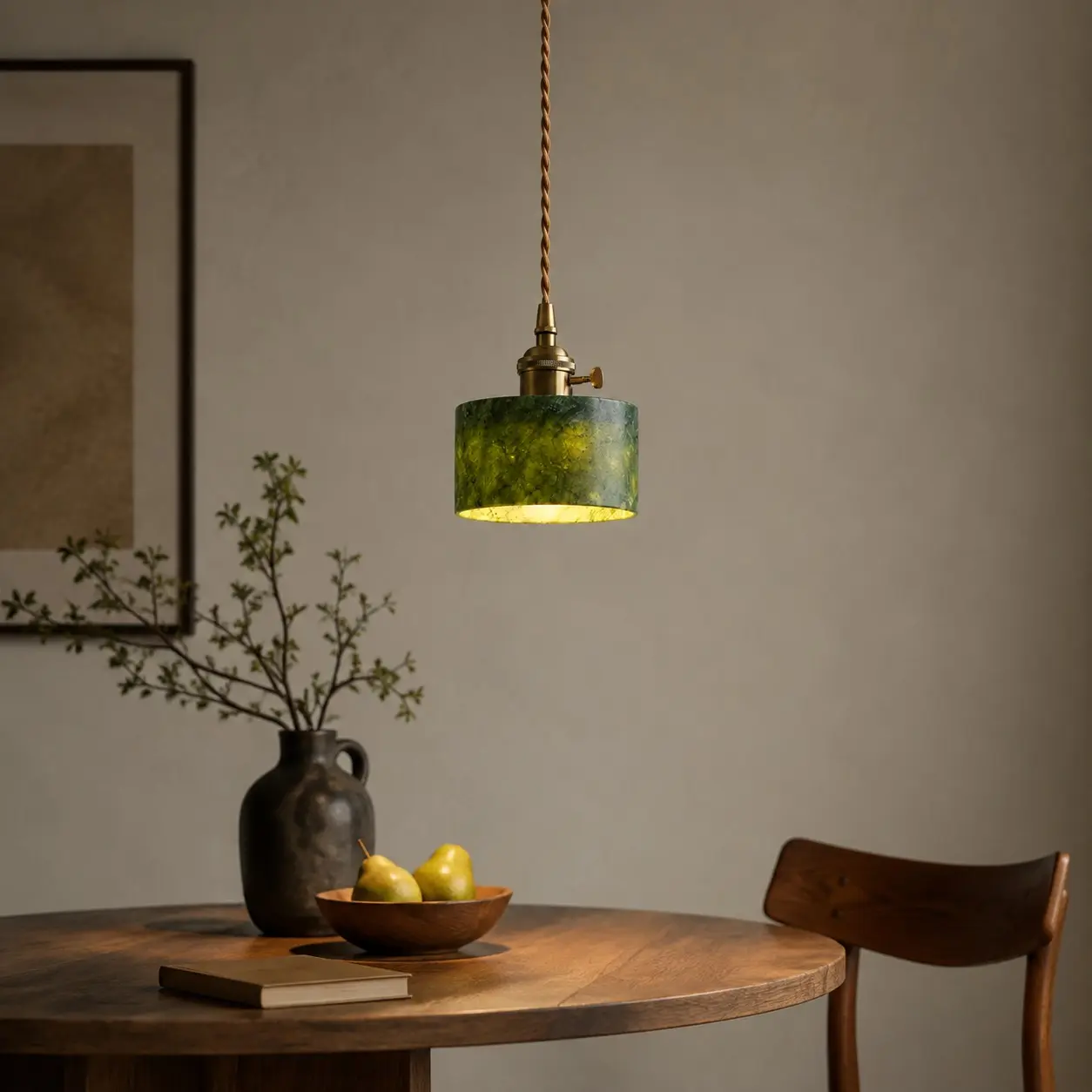 Jade pendant with switch above a dining table