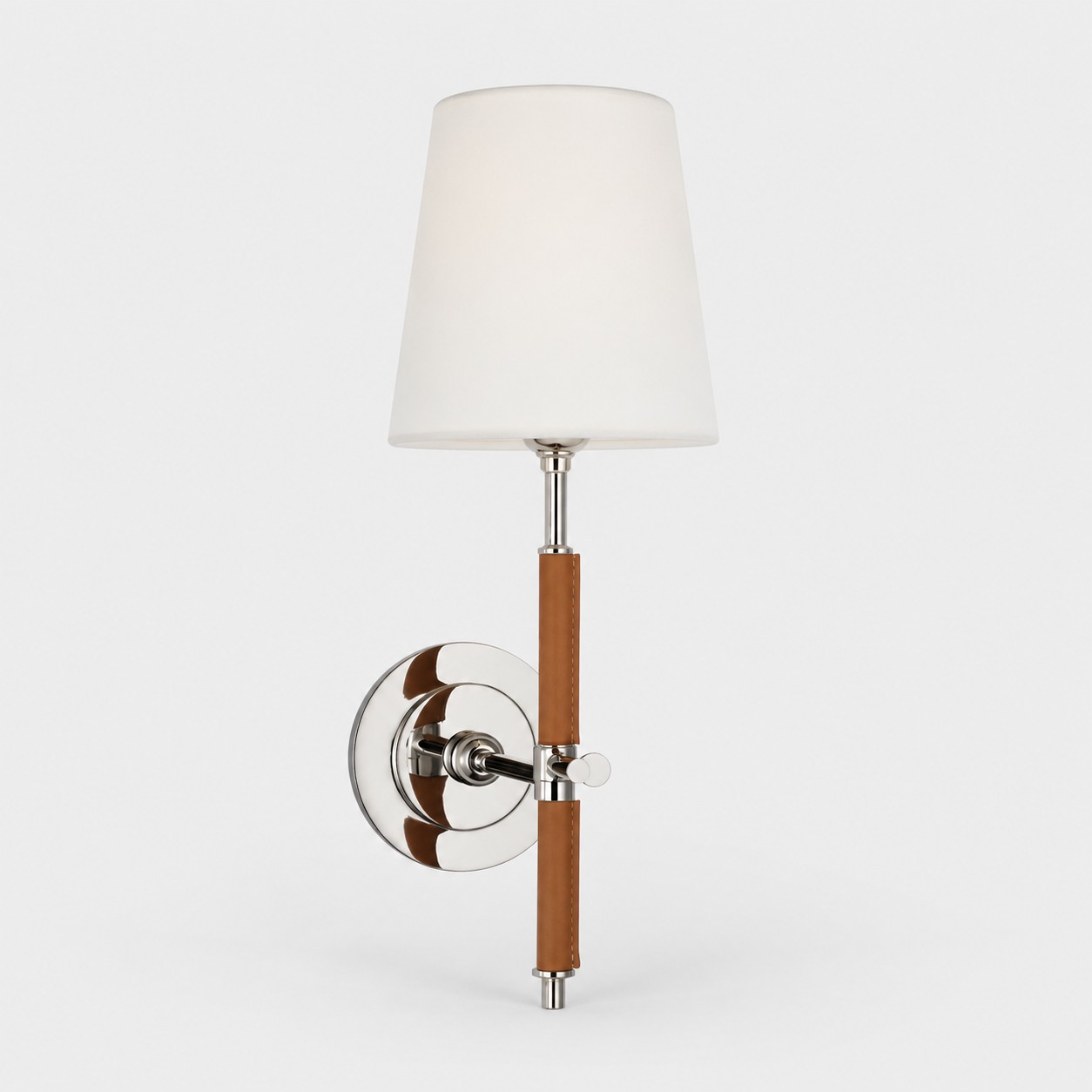 polished silver wall sconce with brown leather and white fabric shade