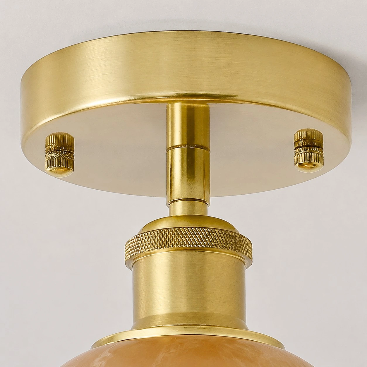 Brass-toned canopy and fitting detail
