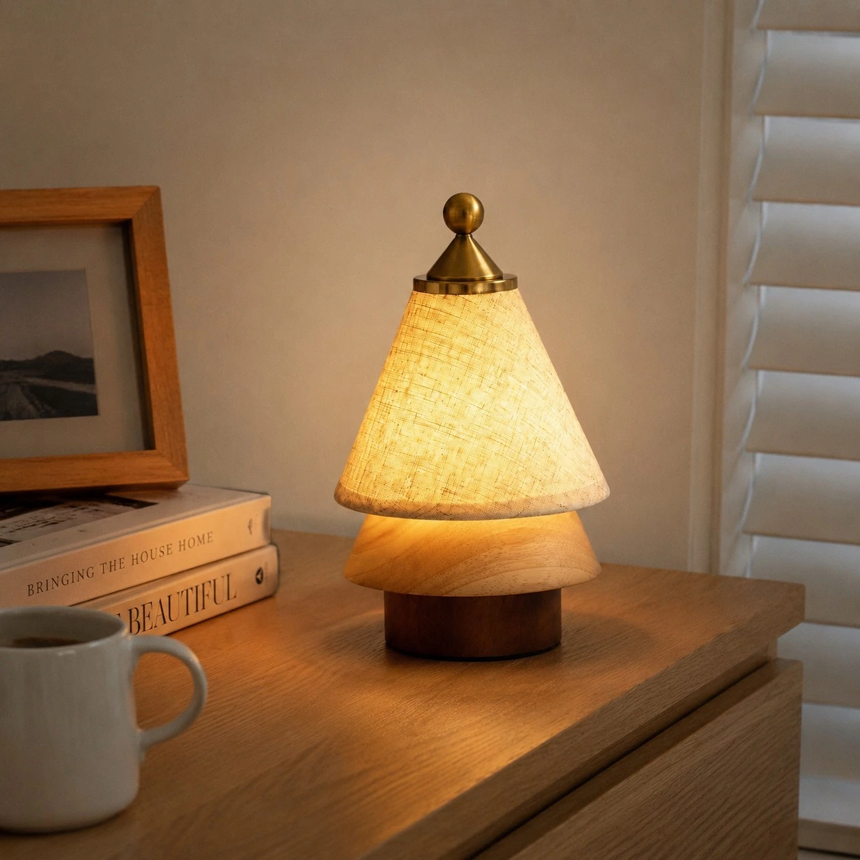 Rechargeable table lamp glowing on a bedside cabinet