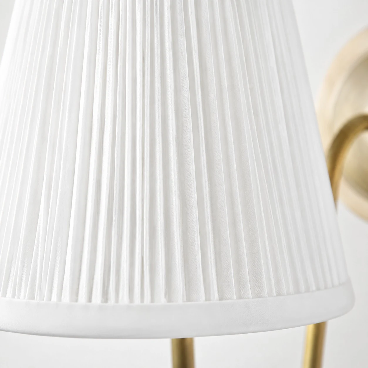 Close-up of the white pleated fabric shade
