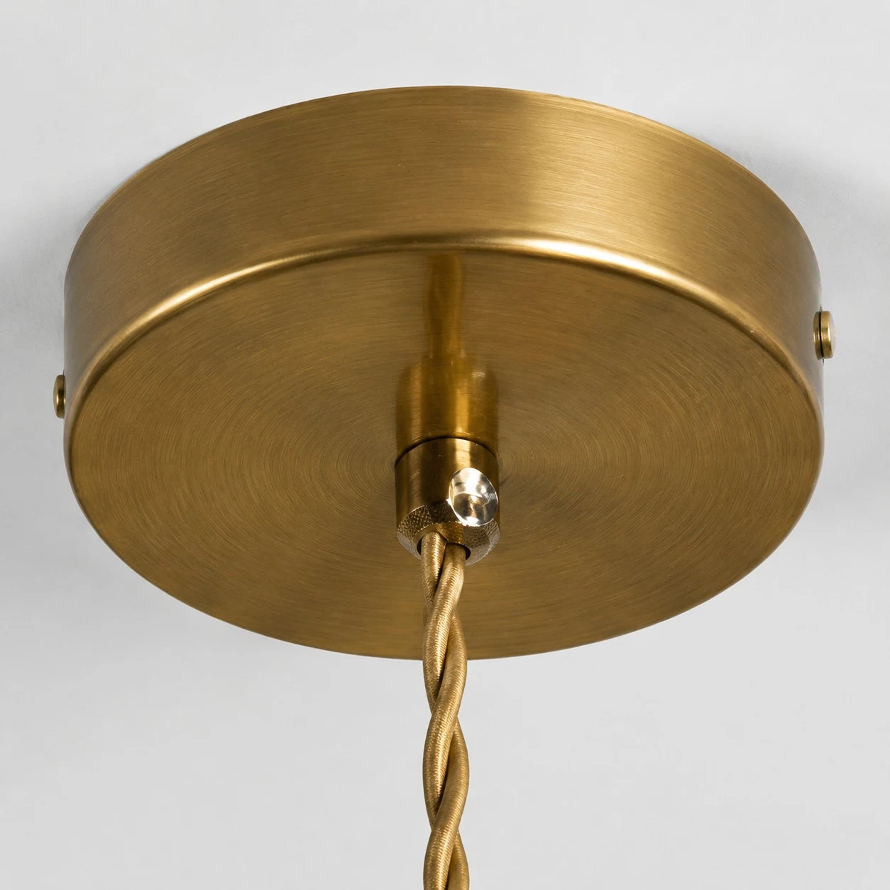 Brass-tone ceiling canopy detail