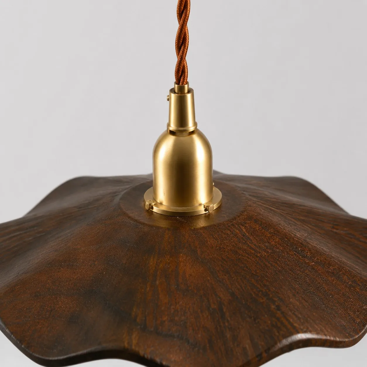 dark wood lotus pendant light brass socket detail